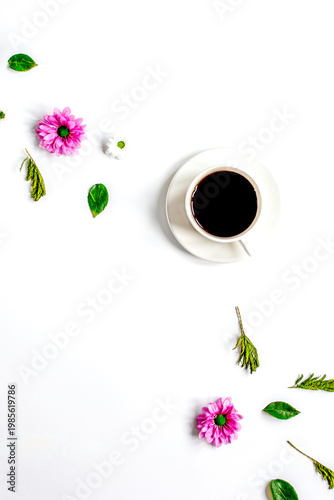 Petals and coffee cup on table background top view mock up