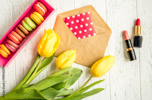 flowers spring tulips top view on wooden background