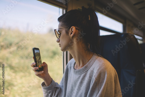 Female traveler capturing journey with smartphone