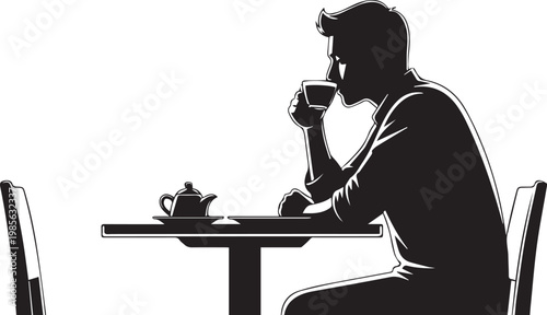 A man sits alone at a table lost in thought and contemplation