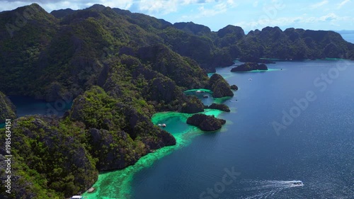 Coron Lagoon with limestone karsts turquoise waters. Great aerial view drone