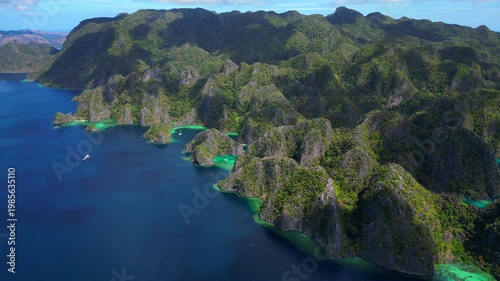 Coron Lagoon with limestone karsts turquoise waters. Amazing aerial view drone