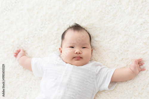 Fényképezés Cute Chinese baby on Bed