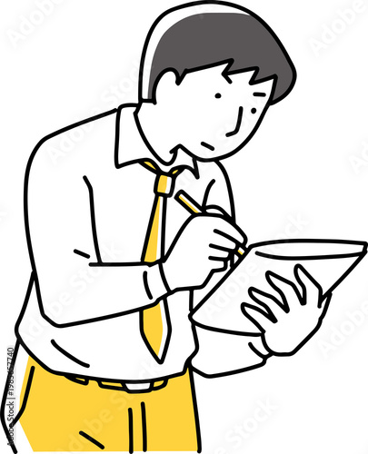 メモを取っている男性社員
