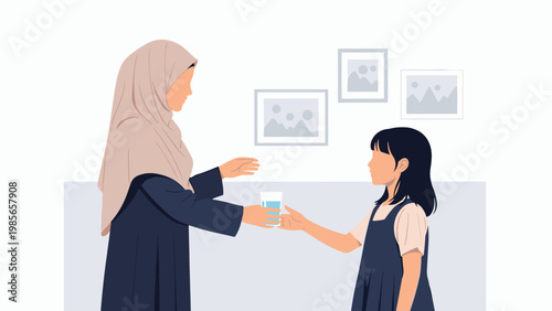 Kind woman in a beige hijab offers a fresh glass of water to a young girl in a blue dress inside a bright home with picture frames.