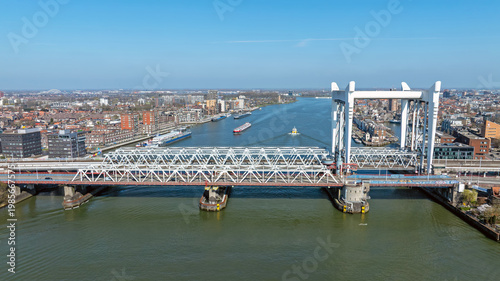 City bridge over a wide river with urban infrastructure in Europe