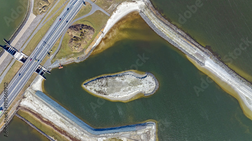 Topshot from a coastal dam with ecological waterway infrastructure in Europe