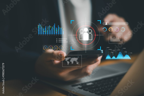 young entrepreneur using AI big data analysis and cloud technology to collect customer data and display on application dashboard from digital tablet to understand sale forecast and marketing plan