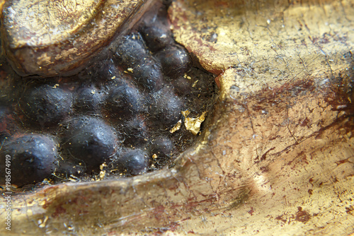 Close View of Textured Surface on a Golden Statue From an Ancient Culture Found in an Archaeological Site