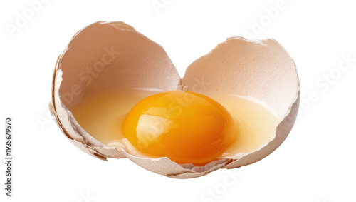 Tableau sur toile Cracked brown eggshell with bright yellow yolk and clear albumen, isolated on tr