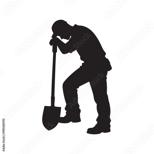 Silhouette of a tired construction worker leaning on a shovel after a long day of hard work.
