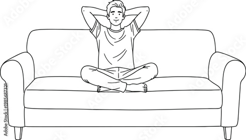 Man relaxing sitting cross legged on a couch