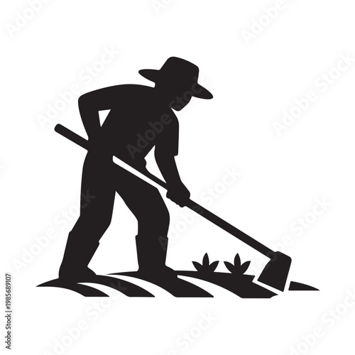 Silhouette of a hardworking farmer cultivating the soil with a hoe in a rural field setting