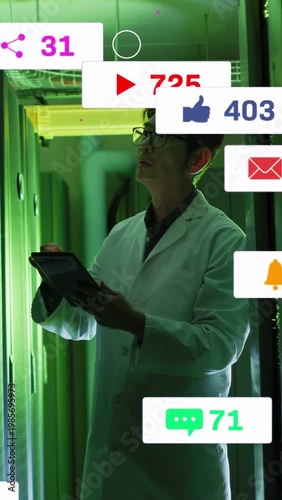 Mature Korean engineer scanning racks with tablet, causing notifications drifting while inspecting