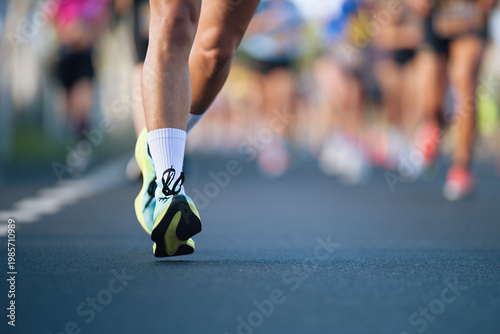 Marathon running race, people feet on city road, runners run urban marathon in the the city