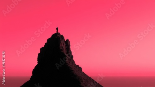 Person Standing on Mountain Peak Against Vibrant Pink Sunset Sky