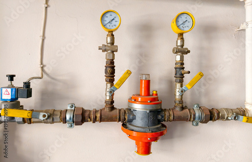 Details of plumbing system showing pressure gauges and control valves in a building