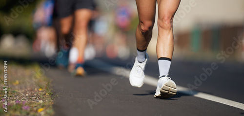 Marathon running race, people feet on city road, runners run urban marathon in the the city