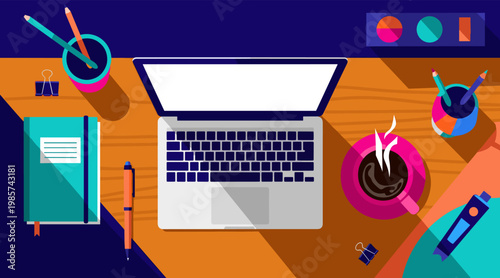 Laptop centered on desk with coffee cup and stationery items