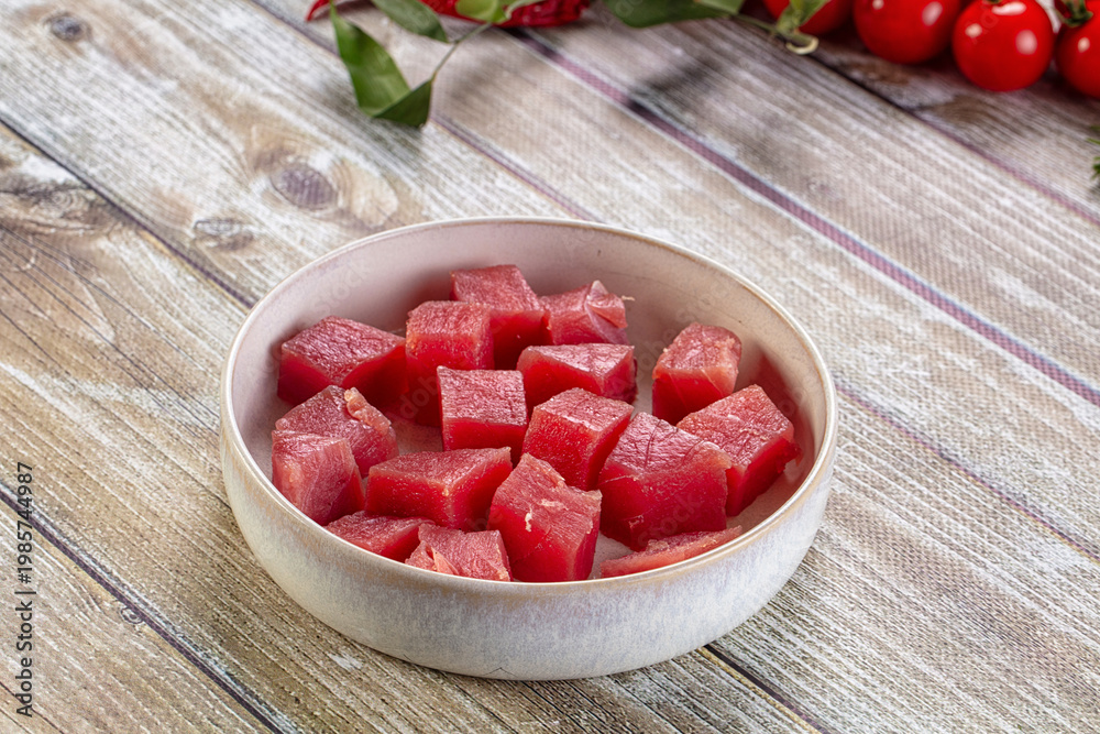Obraz premium Raw tuna fish cubes heap