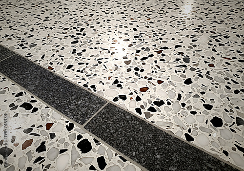 A black line on a white surface with black and brown speckles