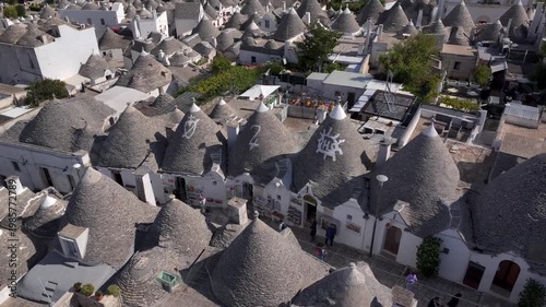 Traditional Trulli Rooftops, Aerial Shot of Unique Conical Roofed Houses of Alberobello in Puglia, Italy. Sunny Day.