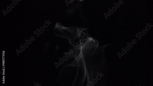 White smoke on black background