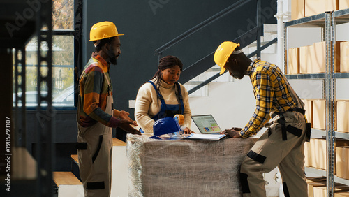 Manager catching employees wasting time in warehouse, team of people talking and laughing instead of packing products in boxes for distribution. Supervisor putting workers to do job.