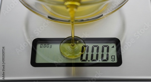 Close-up of Olive Oil Being Weighed on a Digital Kitchen Scale.