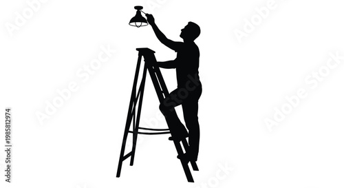 Silhouette of a man on a ladder changing a lightbulb above a table