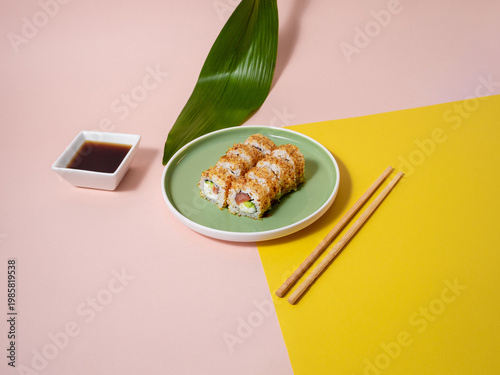 Mouthwatering proximity shot of fried tempura sushi with condiments