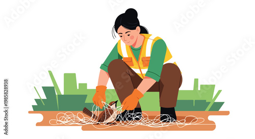 A volunteer in a safety vest carefully untangles a small bird from a white net