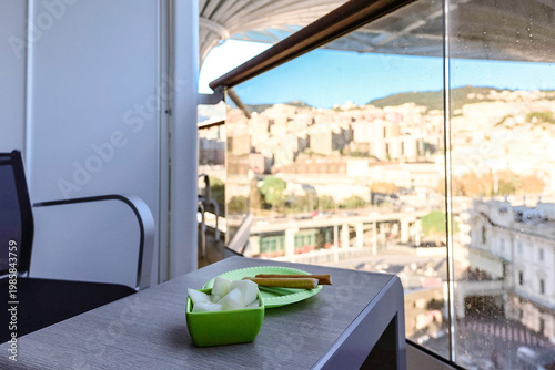 Cruise ship balcony with breakfast and ocean viewCruise ship balcony with simple breakfast and modern deck architecture soft daylight and relaxed travel atmosphere at sea