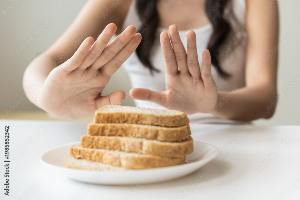 Ταπετσαρία Gluten allergy, asian young woman hand push out, refusing to eat white bread slice on plate in breakfast food meal at home, girl having a stomach ache