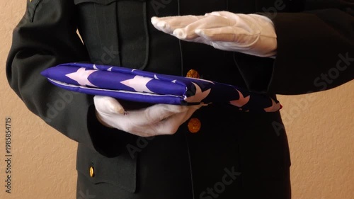 Honoring service soldier presenting flag to family during solemn tribute ceremony honoring sacrifice and remembrance of veterans with respect and dignity