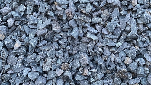 Schilderij op canvas A pile of gravel with a rough texture and a natural gray color