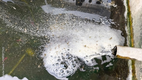 Obraz na plátně Fish pond aeration with water bubbles from pipe, aquaculture oxygen system, fish