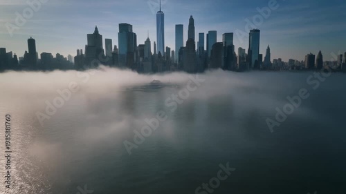 Cinematic FPV drone flying low above river surface toward New York City skyline,