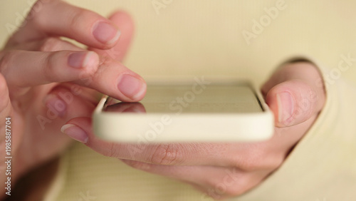 Fotografie Close-up of girl using smartphone touchscreen