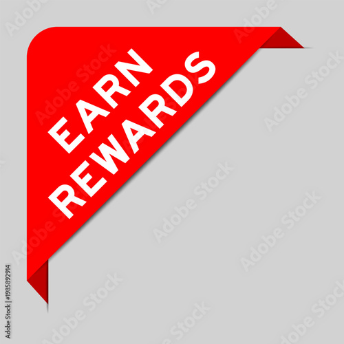 Red color of corner label banner with word earn rewards on gray background