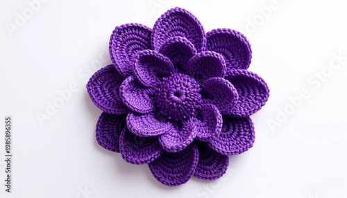 Overhead View of a Knitted Purple Flower on a White Background