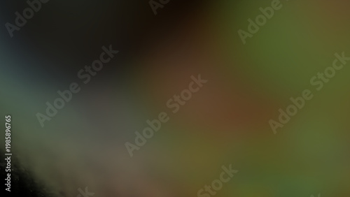 Abstract blurred background with dark green, brown, and olive color gradient, soft focus, and smooth color blend for digital design projects.