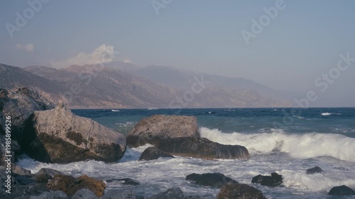 waves crashing on a rocky shore in slow motion 