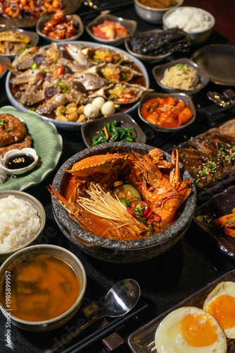 Traditional Korean meal with seafood and side dishes