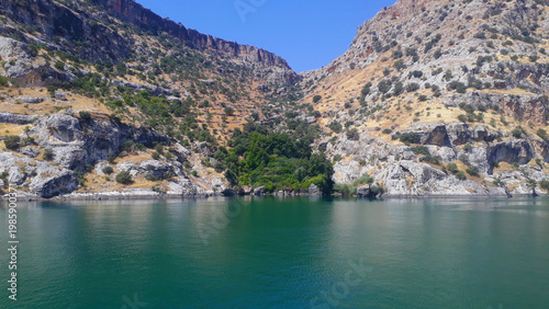 lake in the mountains. Limestone cliffs on the shores. 
