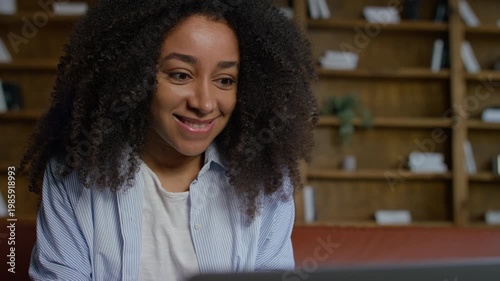Woman reading exciting message on laptop