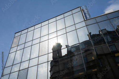 the reflections of the sun on the windows of a modern building in Dublin, Ireland