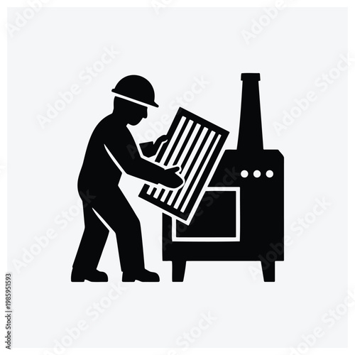 Worker operating a printing or roller press machine.