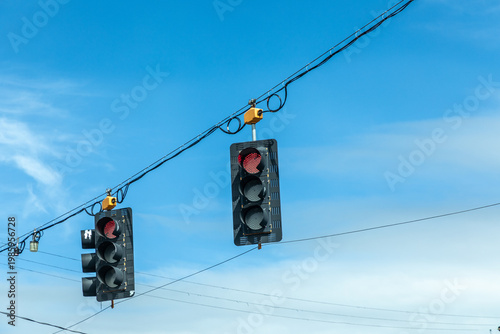 Wallpaper Mural traffic lights in black and yellow hanging at a crossing with red stop light on Torontodigital.ca