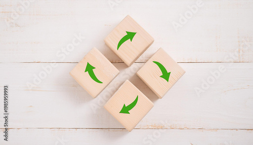 Green Arrows Forming Circular Motion on Wooden Blocks – Sustainability, Recycling, and Process Flow Concept